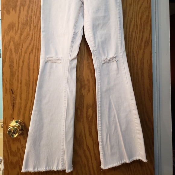 Cute white jeans, ripped at knees with flare bottoms. Great condition. - Picture 2 of 8